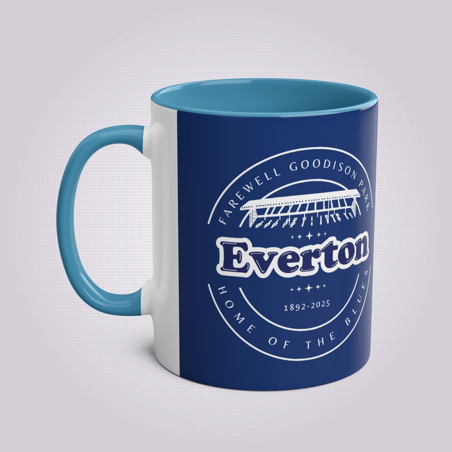Shows the light blue handle and infill colour with the handle on the left the mug colour is in navy with the graphic of goodison park and the words around it written in white, the words read 'Farewell Goodison Park Everton Home of the blues 1892 - 2025'.