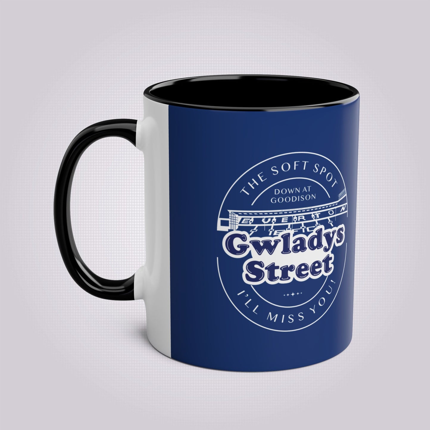 Navy Blue mug with black handle and inners the artwork on the front shows a graphic of the famous Gwladys Street End with the words 'The Soft Spot down at Goodison Gwladys Street I'll Miss You!'