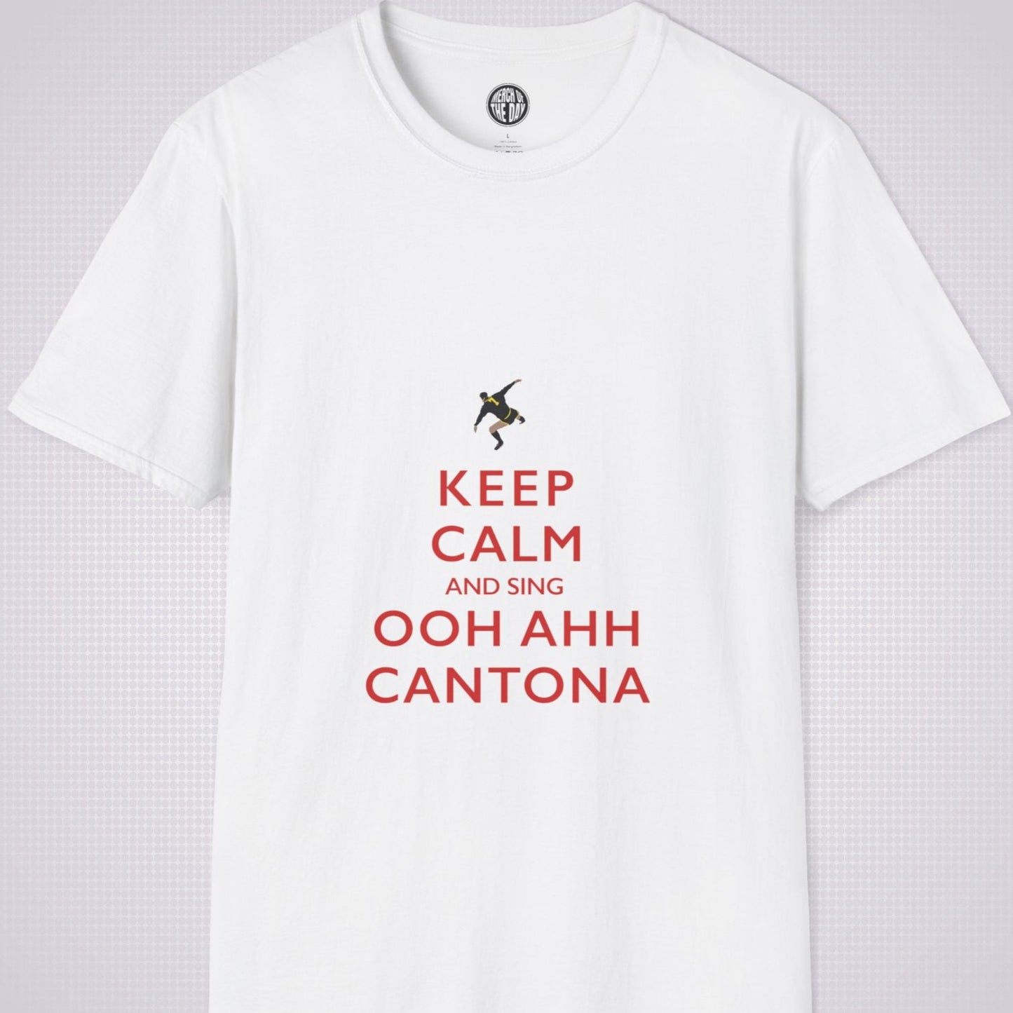 White T Shirt on a light grey dotted backdrop. The design on the shirt is done in the keep calm style which reads 'Keep Calm And Sing Ooh Ahh Cantona' in red text, with a cartoon graphic of Eric's famous kung fu kick above it.