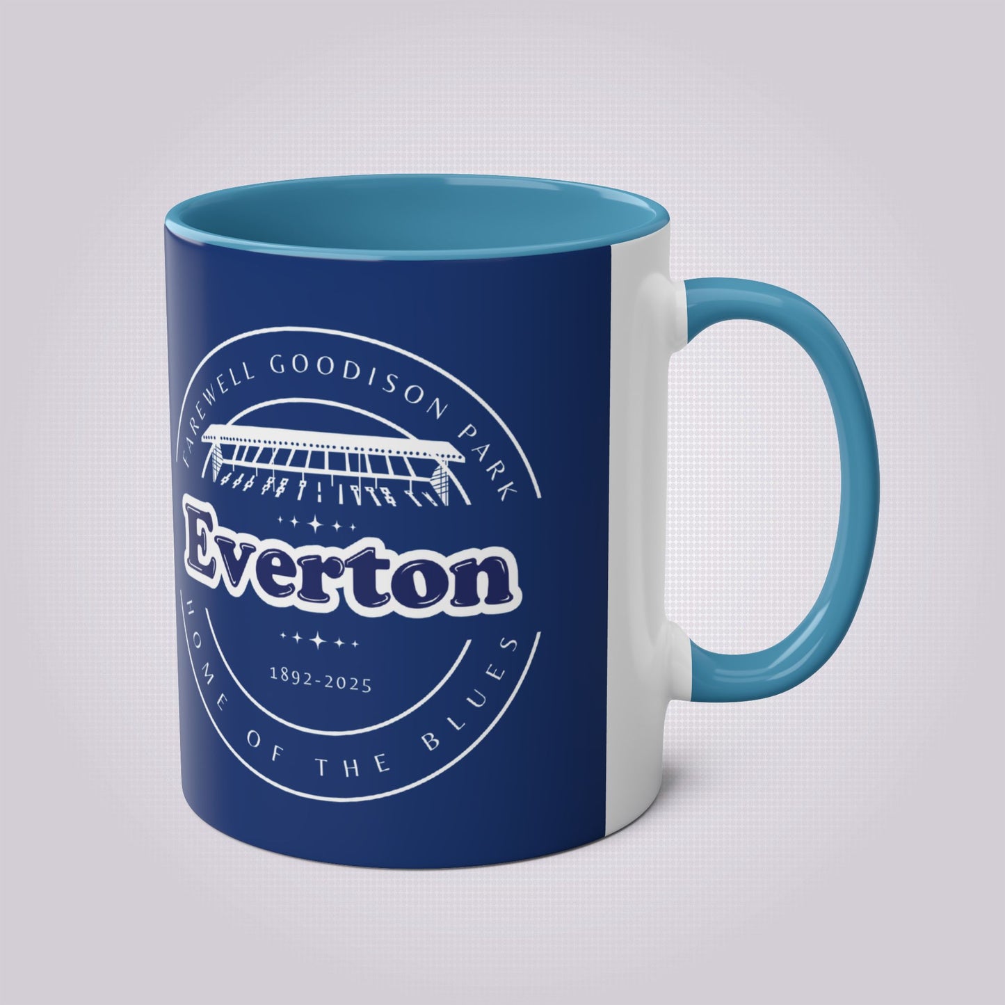 Shows the light blue handle and infill colour with the handle on the right the mug colour is in navy with the graphic of goodison park and the words around it written in white, the words read 'Farewell Goodison Park Everton Home of the blues 1892 - 2025'.