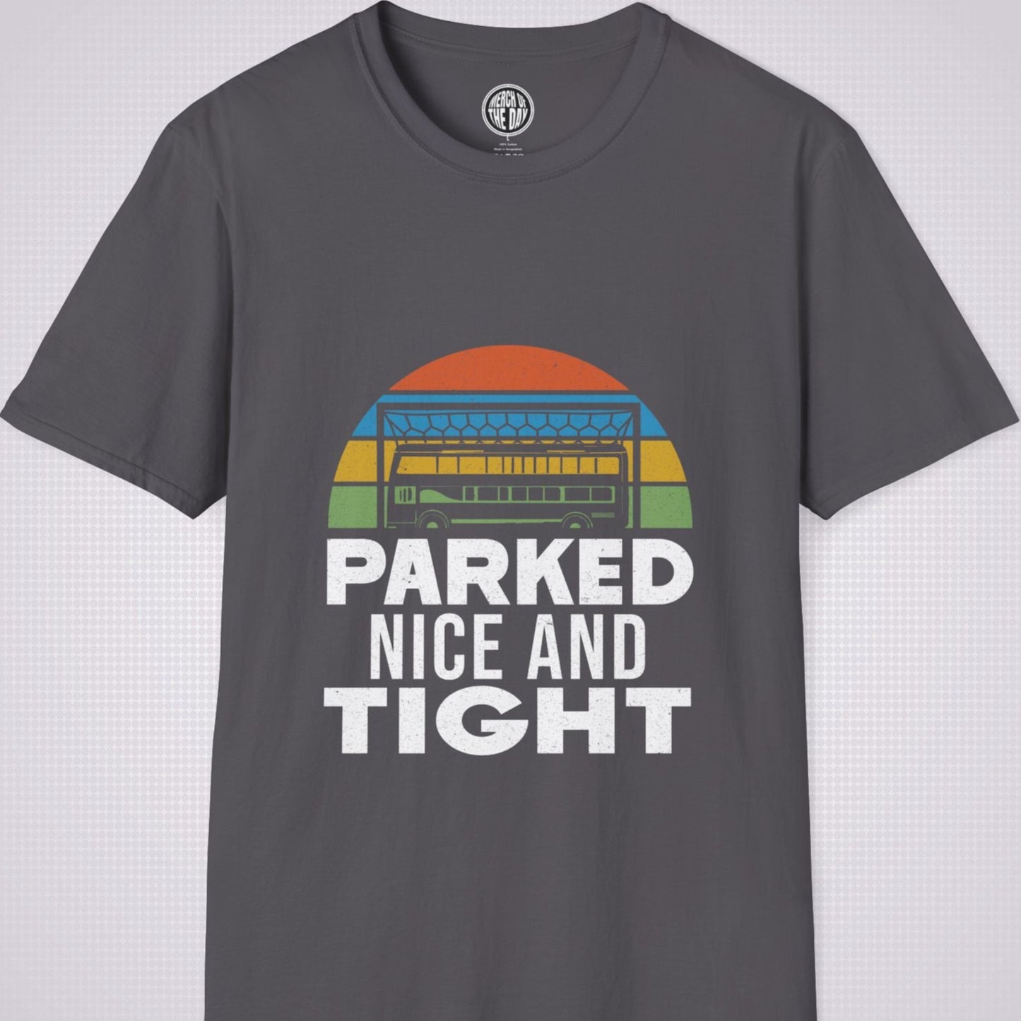 Charcoal T Shirt on a light grey dotted background the graphic shows a distressed sunset with a football goalpost with a bus packed into it and the phrase parked nice and tight