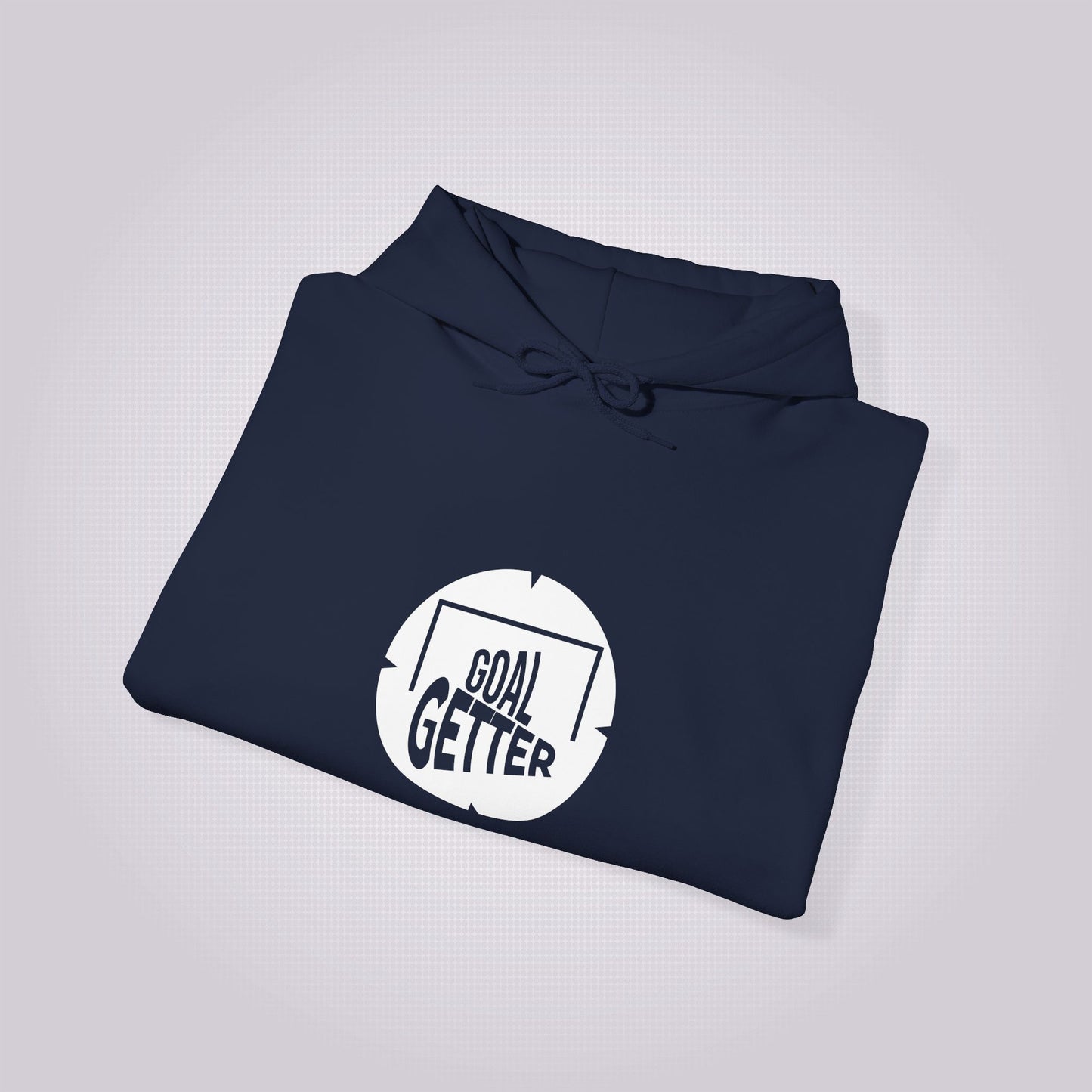 navy hoodie folded up and placed at a right angle