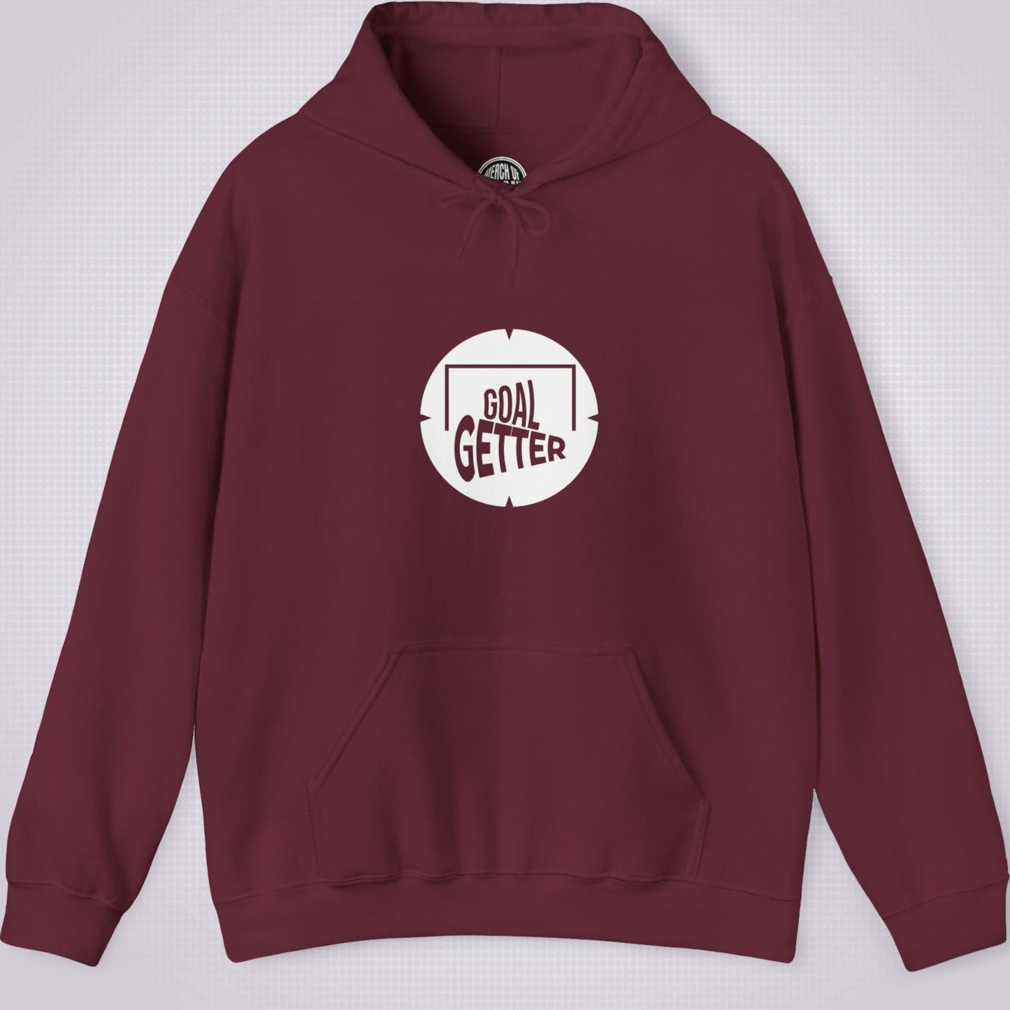 Maroon hoodie on a light grey patterned background. The graphic on the front shows a circle that partially resembles a target and a football with the words goal getter written inside a soccer goal frame