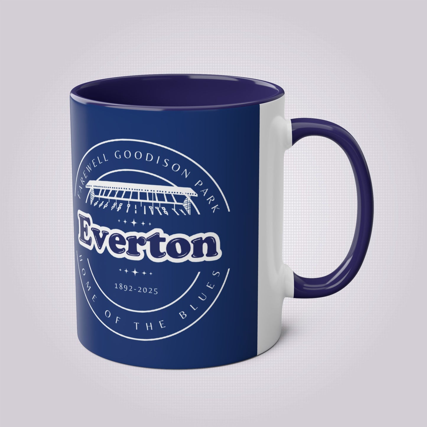 Shows the dark blue handle and infill colour with the handle on the right the mug colour is in navy with the graphic of goodison park and the words around it written in white, the words read 'Farewell Goodison Park Everton Home of the blues 1892 - 2025'.