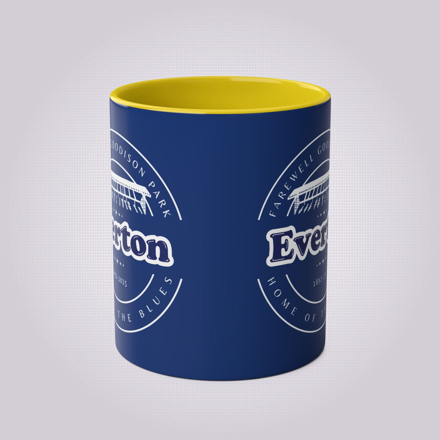 Shows the yellow infill from the front side the outside of the mug is in navy blue colour with the graphic print on both sides