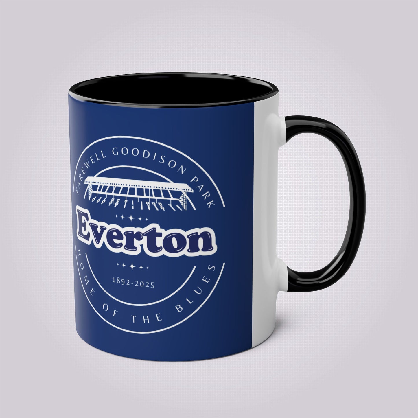 Shows the black handle and infill colour with the handle on the right the mug colour is in navy with the graphic of goodison park and the words around it written in white, the words read 'Farewell Goodison Park Everton Home of the blues 1892 - 2025'.