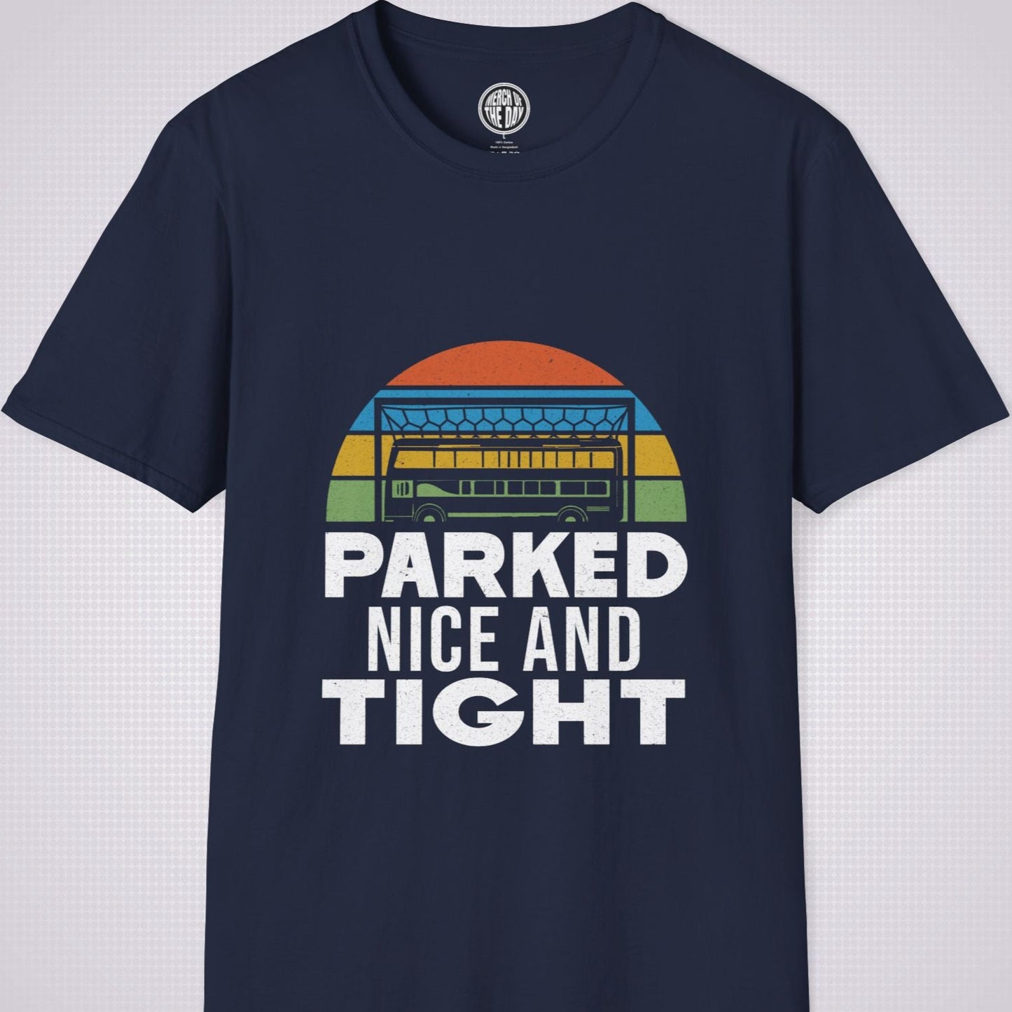 Navy T Shirt on a light grey dotted background the graphic shows a distressed sunset with a football goalpost with a bus packed into it and the phrase parked nice and tight