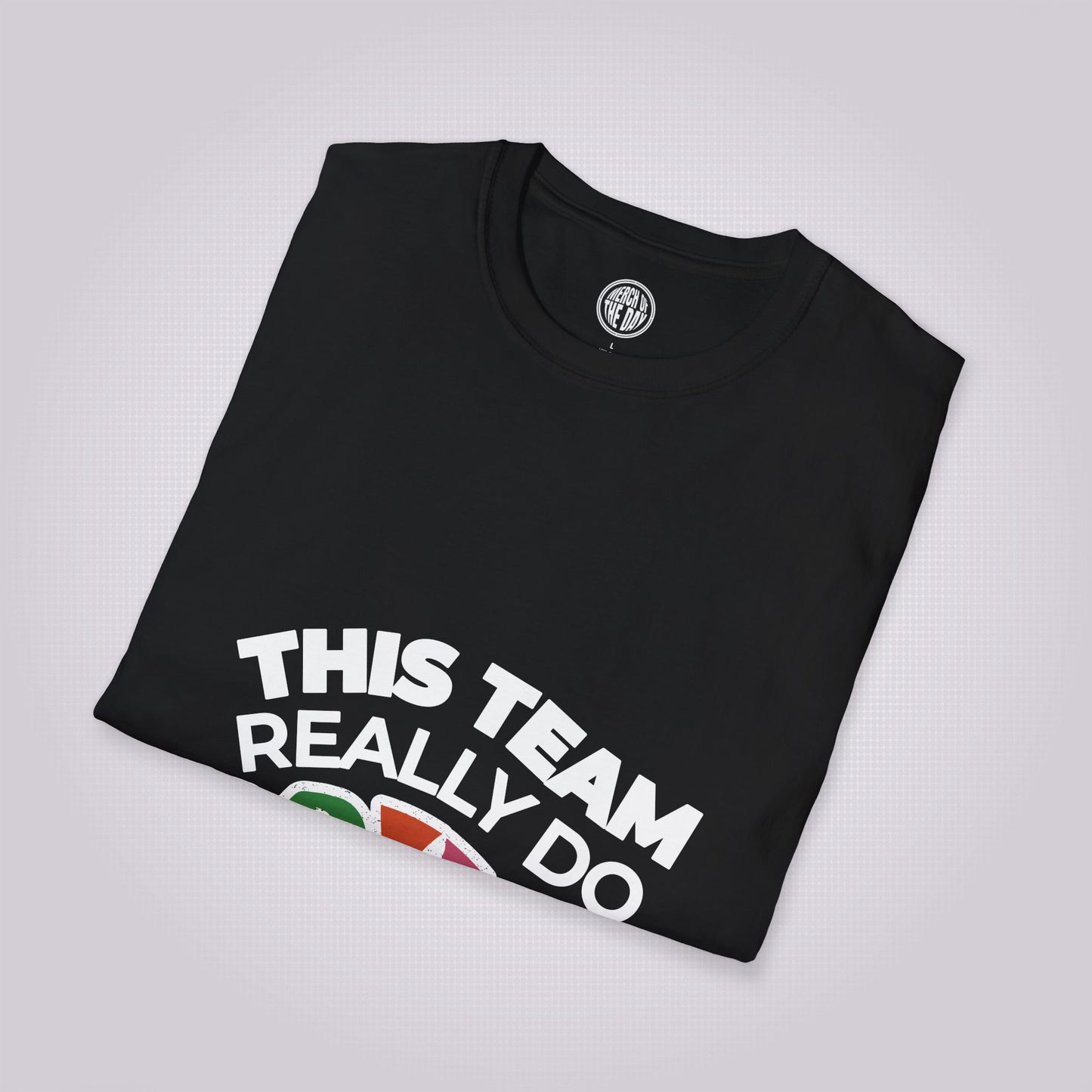 Black t shirt laid at a slight right angle on a light grey dotted background