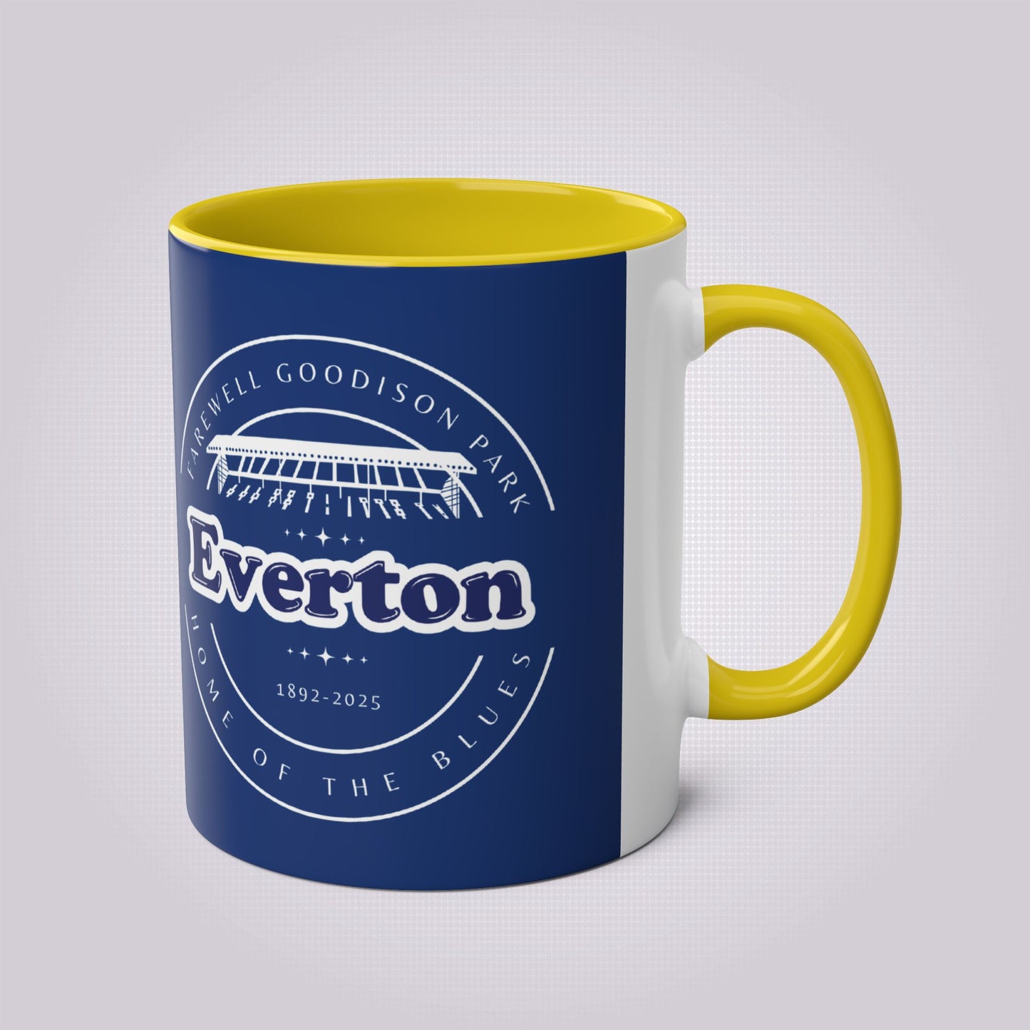 Shows the yellow handle and infill colour with the handle on the right the mug colour is in navy with the graphic of goodison park and the words around it written in white, the words read 'Farewell Goodison Park Everton Home of the blues 1892 - 2025'.