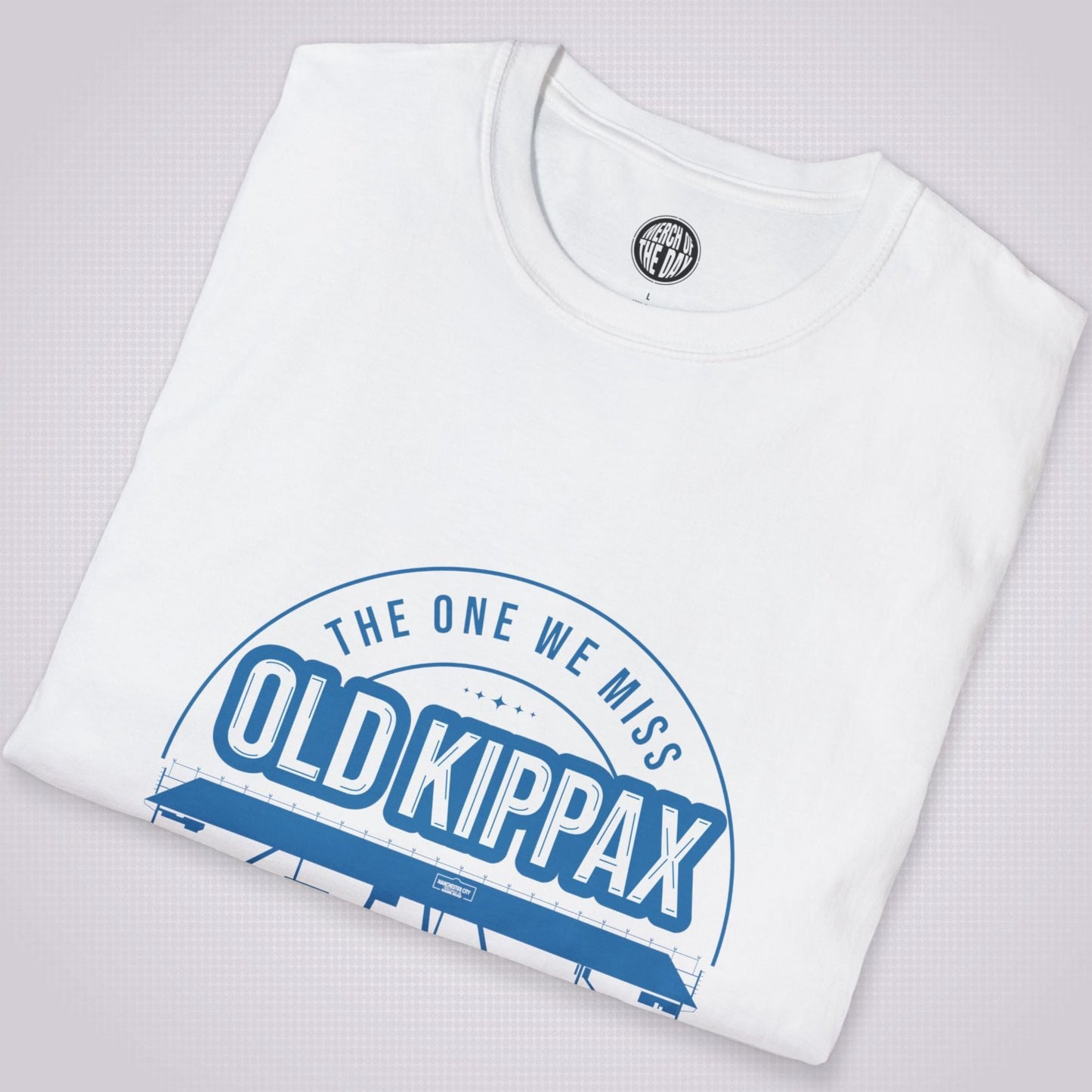 White T Shirt folded and placed at a slight angle shows the top section of the graphic