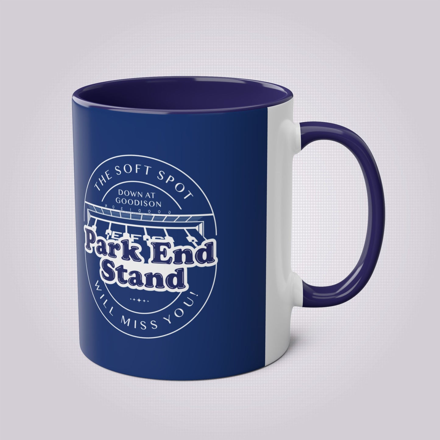 Navy Blue mug and dark blue handle and infill on a light grey dotted background the handle is facing the right while the artwork is on the front