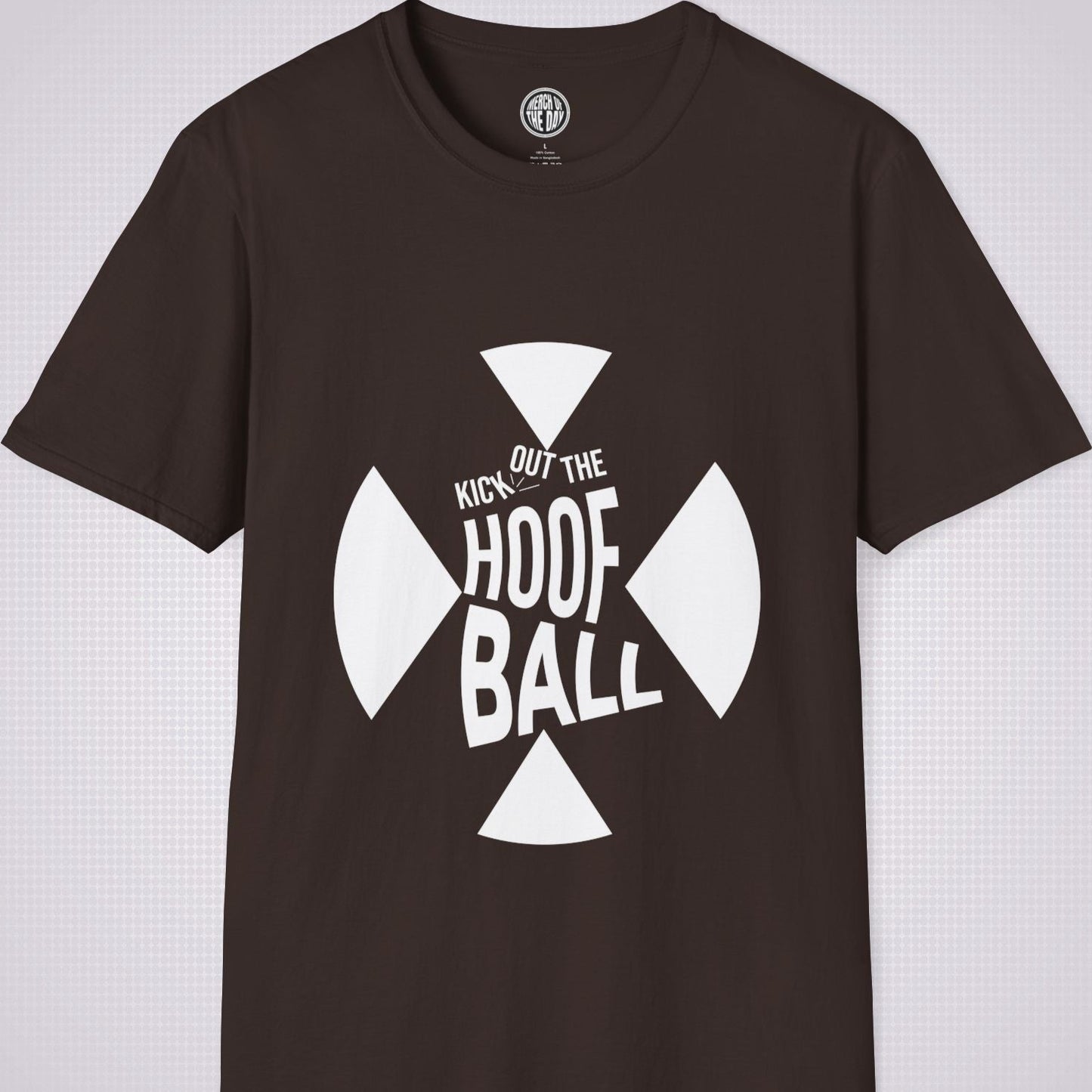 Brownt shirt on a light grey dotted background. The t shirt has a graphic of a giant X within that are the words 'Kick Out The Hoof Ball'