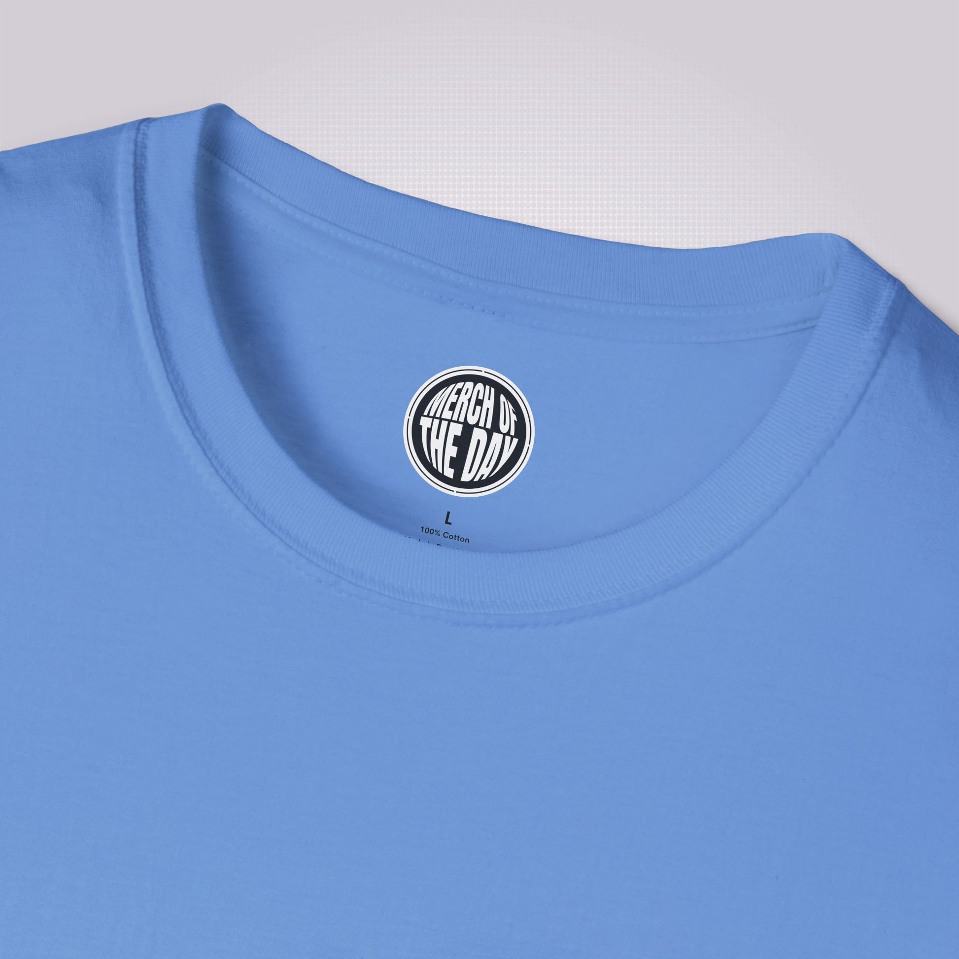 Close up of mid blue t shirt showing the crew neckline and clothing brand logo on the inner neck label
