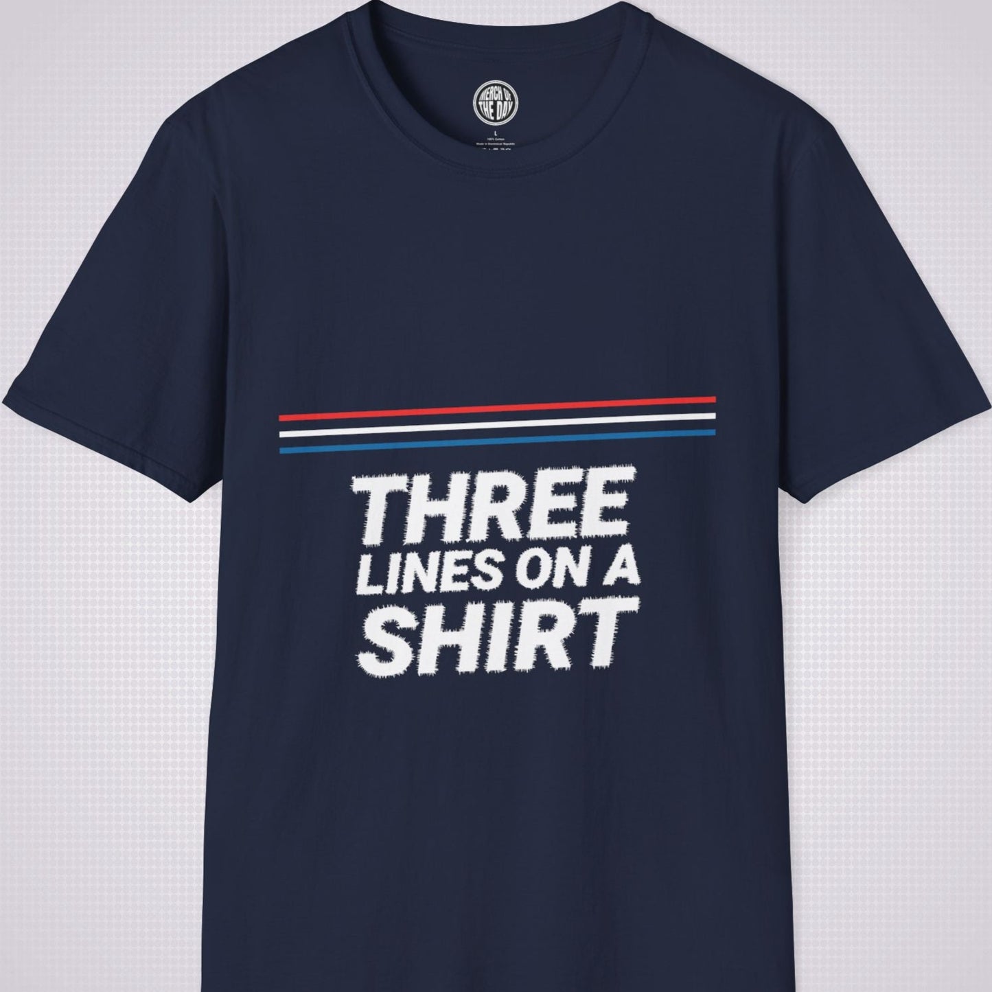 Navy t shirt on a light grey dotted backdrop with a red white and blue diagonal line pattern with the words three lines on a shirt under that