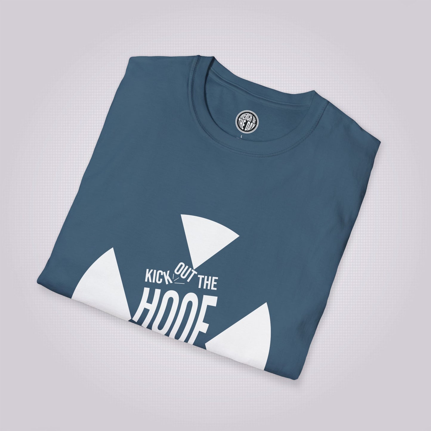 Indigo Blue T Shirt folded and placed at a slight right angle on a light grey dotted background