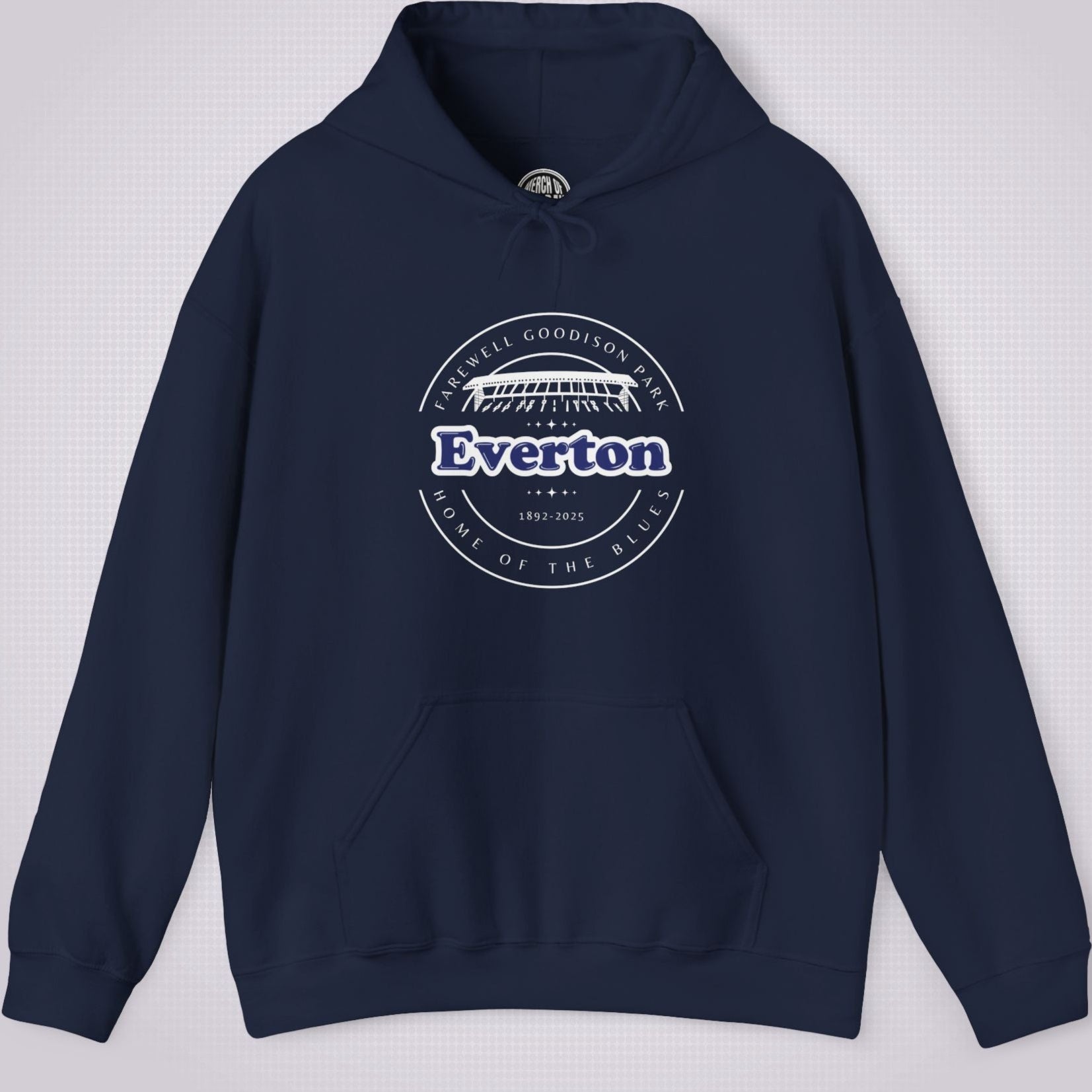 Navy hoodie on a light grey dotted background the artwork shows an illustration of the main stand at goodison park with the words 'Farewell Goodison Park' written in a downward facing arc, then underneath that it reads Everton 1892 to 2025 and underneath that it reads 'Home of the blues' written in an upward facing arc