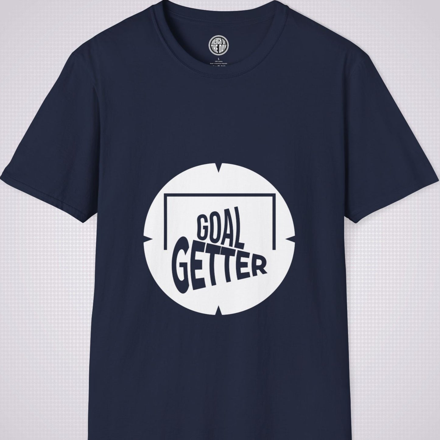 Navy t shirt on a light grey patterned background the artwork on the shirt shows a circle with segments in all 4 corners symbolising a target and a football  and the words read goal getter within a goal frame 