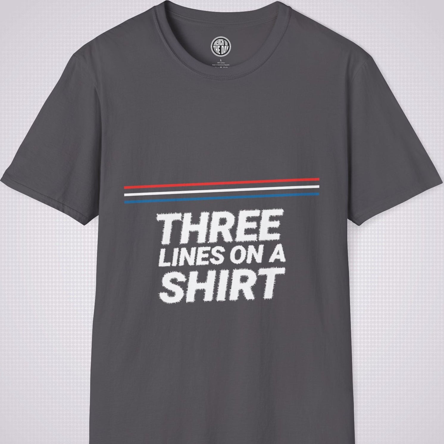 Charcoal t shirt on a light grey dotted backdrop with a red white and blue diagonal line pattern with the words three lines on a shirt under that