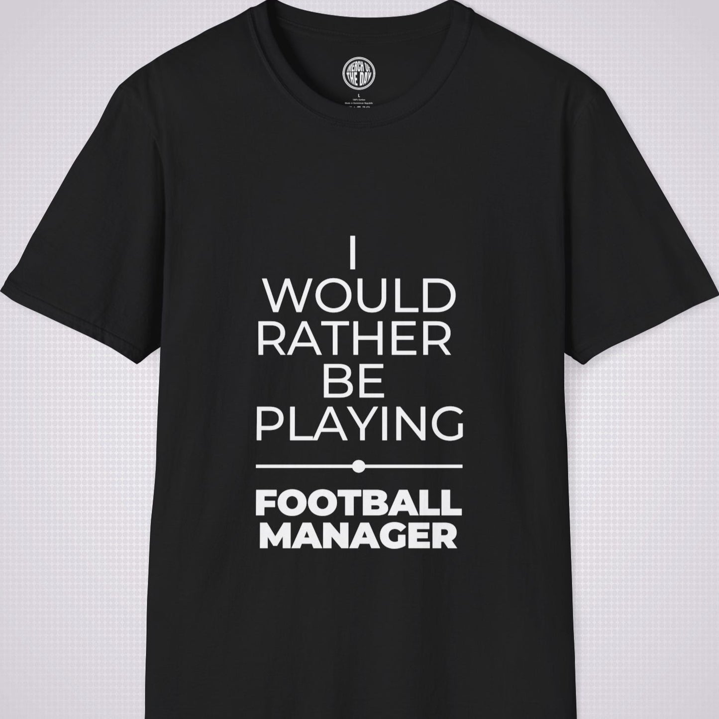 Black t shirt on a light grey patterned backdrop with text on the shirt saying I would rather be playing football manager