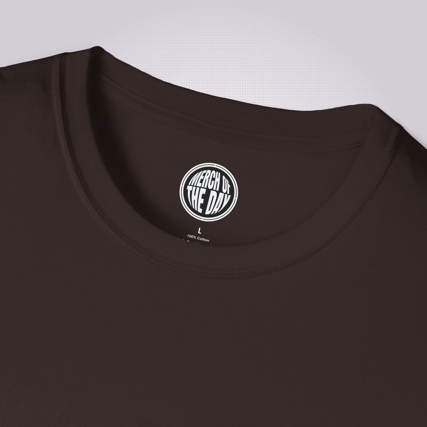 Close up of brown t shirt showing the crew neckline and the clothing brand logo on the inner neck label