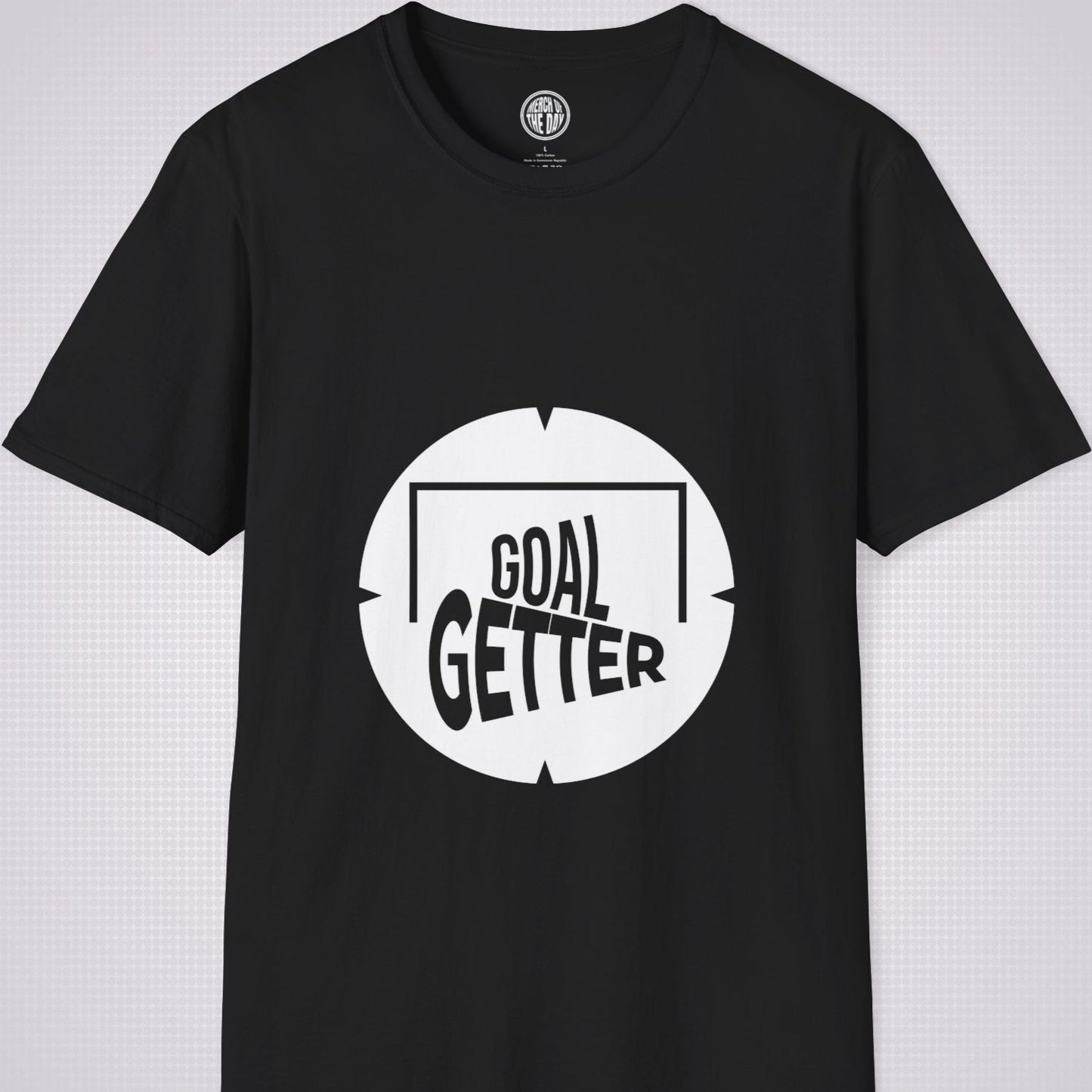 Black t shirt on a light grey patterned background the artwork on the shirt shows a circle with segments in all 4 corners symbolising a target and a football  and the words read goal getter within a goal frame 