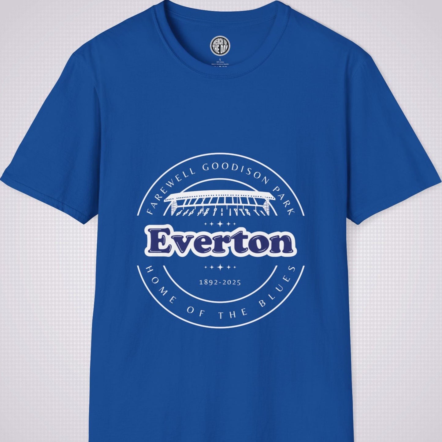 Royal Blue t shirt on a light grey dotted background there is a graphic showing an illustration of the main stand at Goodison Park with the words 'Farewell Goodison Park' written in a downward facing arc above it, below it are the  words 'Everton 1892 to 2025' and then below that are the words 'Home of the blues' written in an upward facing arc