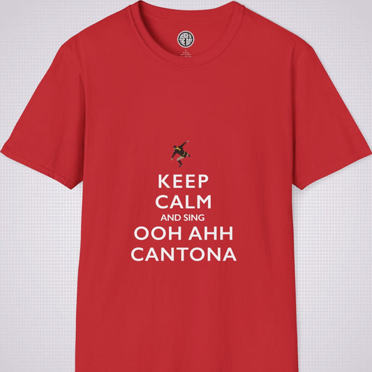 Red T Shirt on a light grey dotted backdrop. The design on the shirt is done in the keep calm style which reads 'Keep Calm And Sing Ooh Ahh Cantona' in red text, with a cartoon graphic of Eric's famous kung fu kick above it.