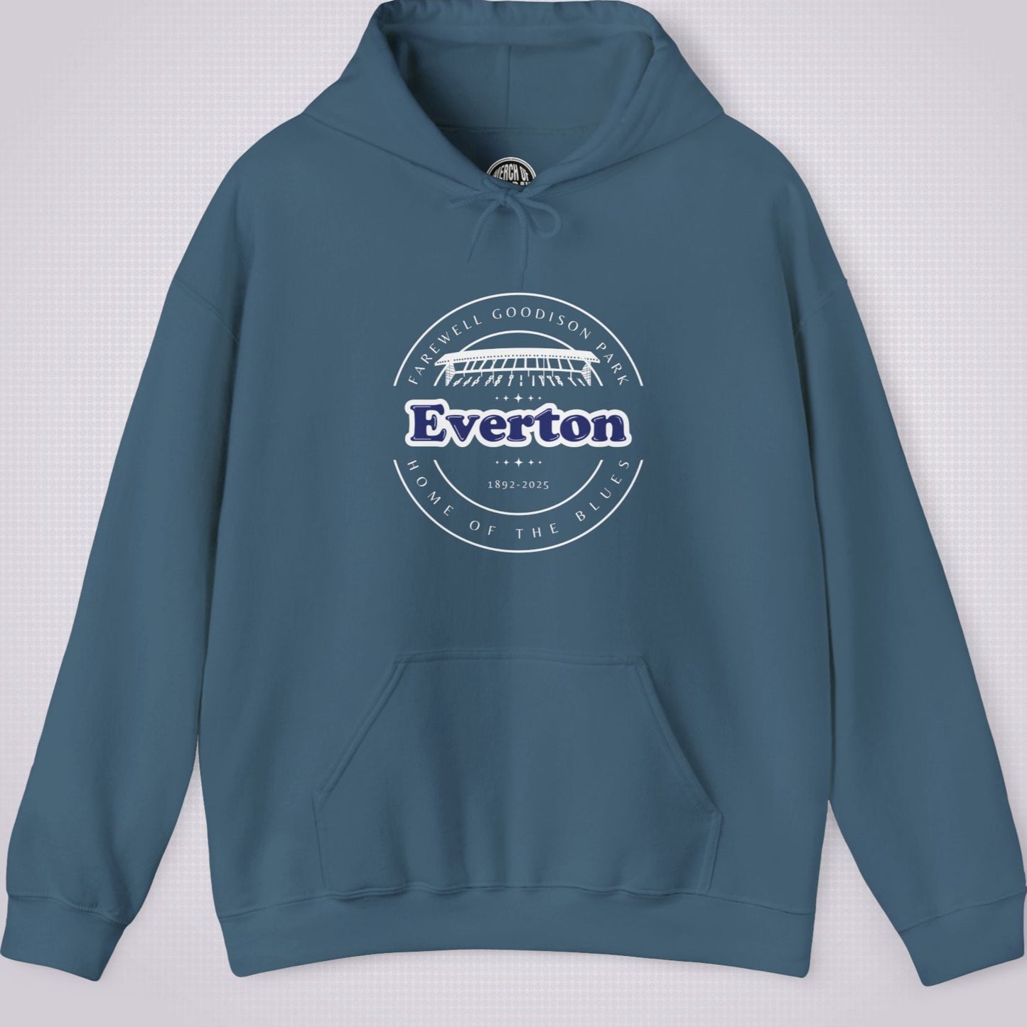 Indigo Blue hoodie on a light grey dotted background the artwork shows an illustration of the main stand at goodison park with the words 'Farewell Goodison Park' written in a downward facing arc, then underneath that it reads Everton 1892 to 2025 and underneath that it reads 'Home of the blues' written in an upward facing arc