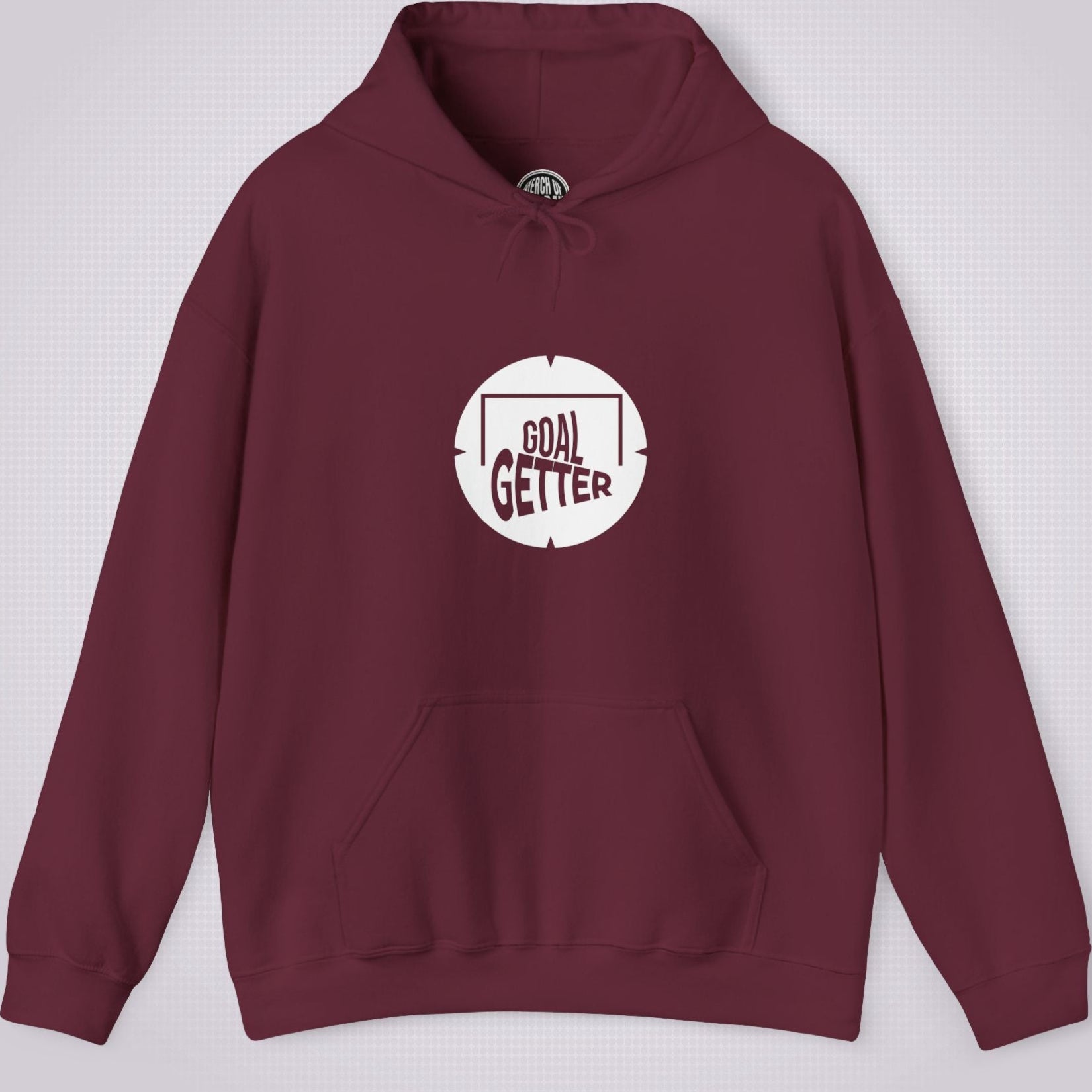 Maroon hoodie on a light grey patterned background. The graphic on the front shows a circle that partially resembles a target and a football with the words goal getter written inside a soccer goal frame