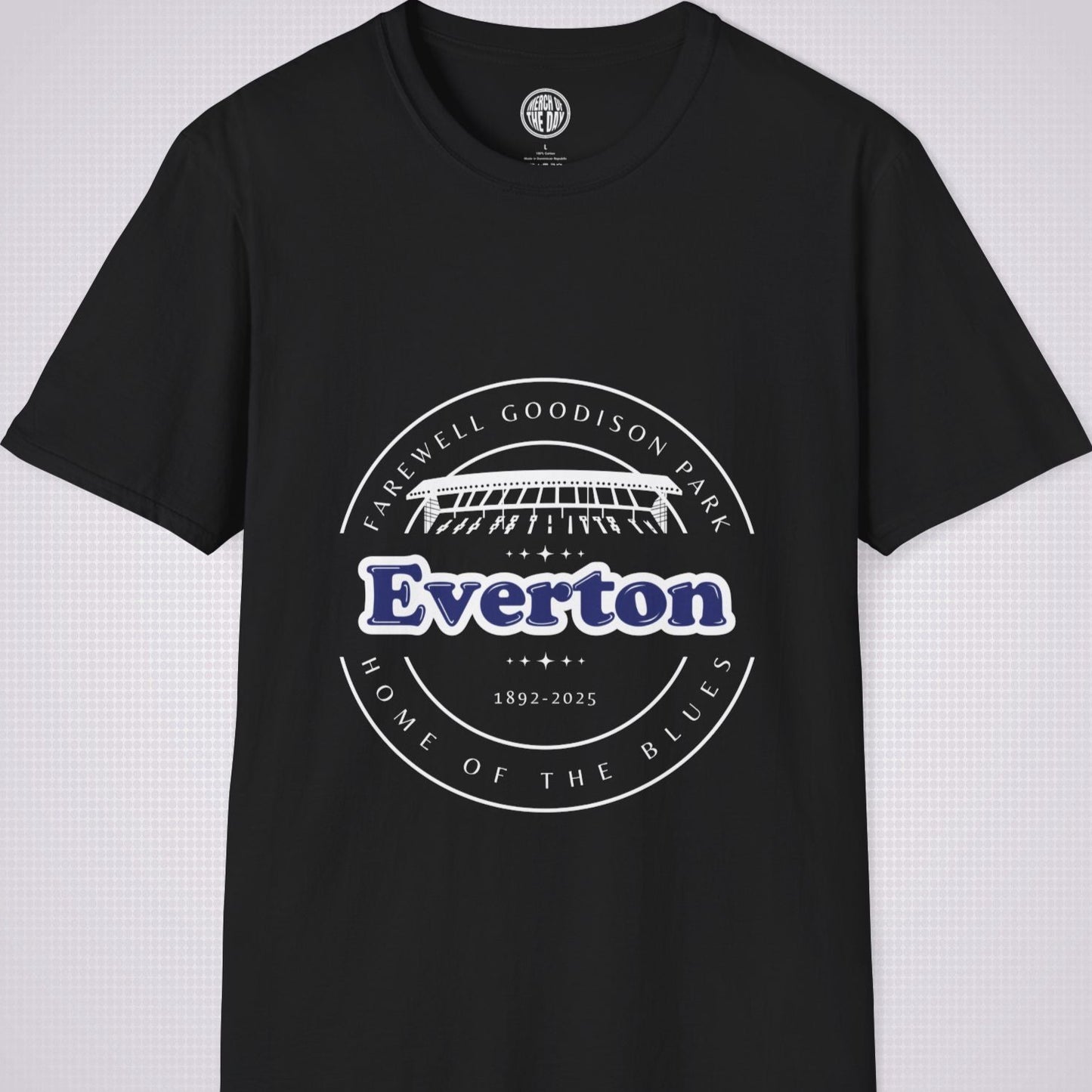 Black t shirt on a light grey dotted background there is a graphic showing an illustration of the main stand at Goodison Park with the words 'Farewell Goodison Park' written in a downward facing arc above it, below it are the  words 'Everton 1892 to 2025' and then below that are the words 'Home of the blues' written in an upward facing arc