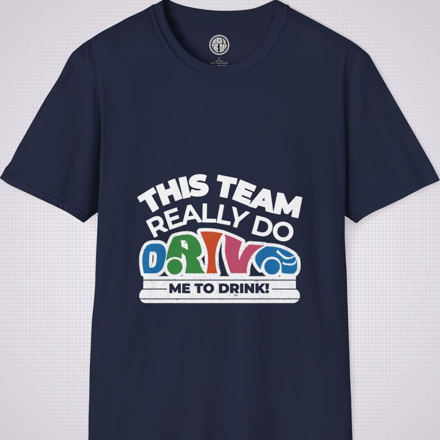 Navy t shirt on a light grey dotted background the shirt graphic says the words 'this team really do' followed by a car shaped word which spells 'drive' then under that it reads the words 'me to drink'