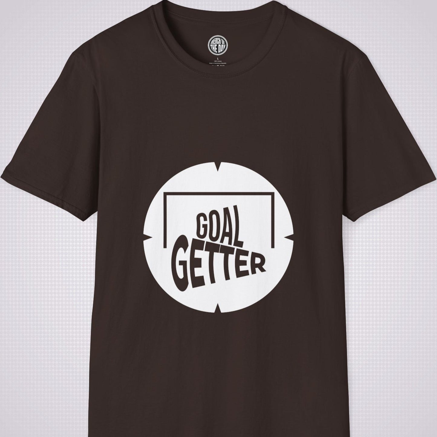 Brown t shirt on a light grey patterned background the artwork on the shirt shows a circle with segments in all 4 corners symbolising a target and a football  and the words read goal getter within a goal frame 