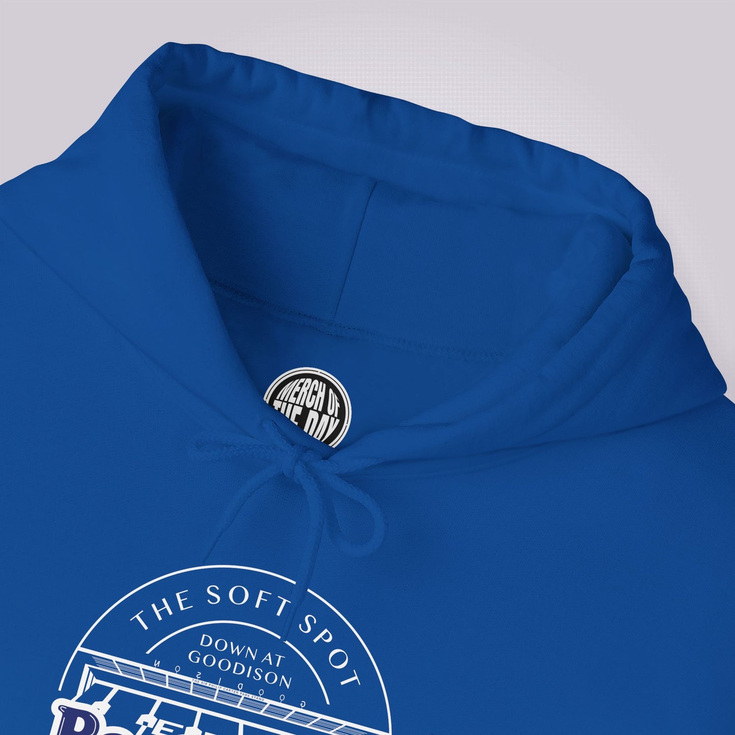 Close up of Royal Blue hoodie showing the crew neckline and the drawcord tied up also visible is the clothing brand logo on the inner neck label