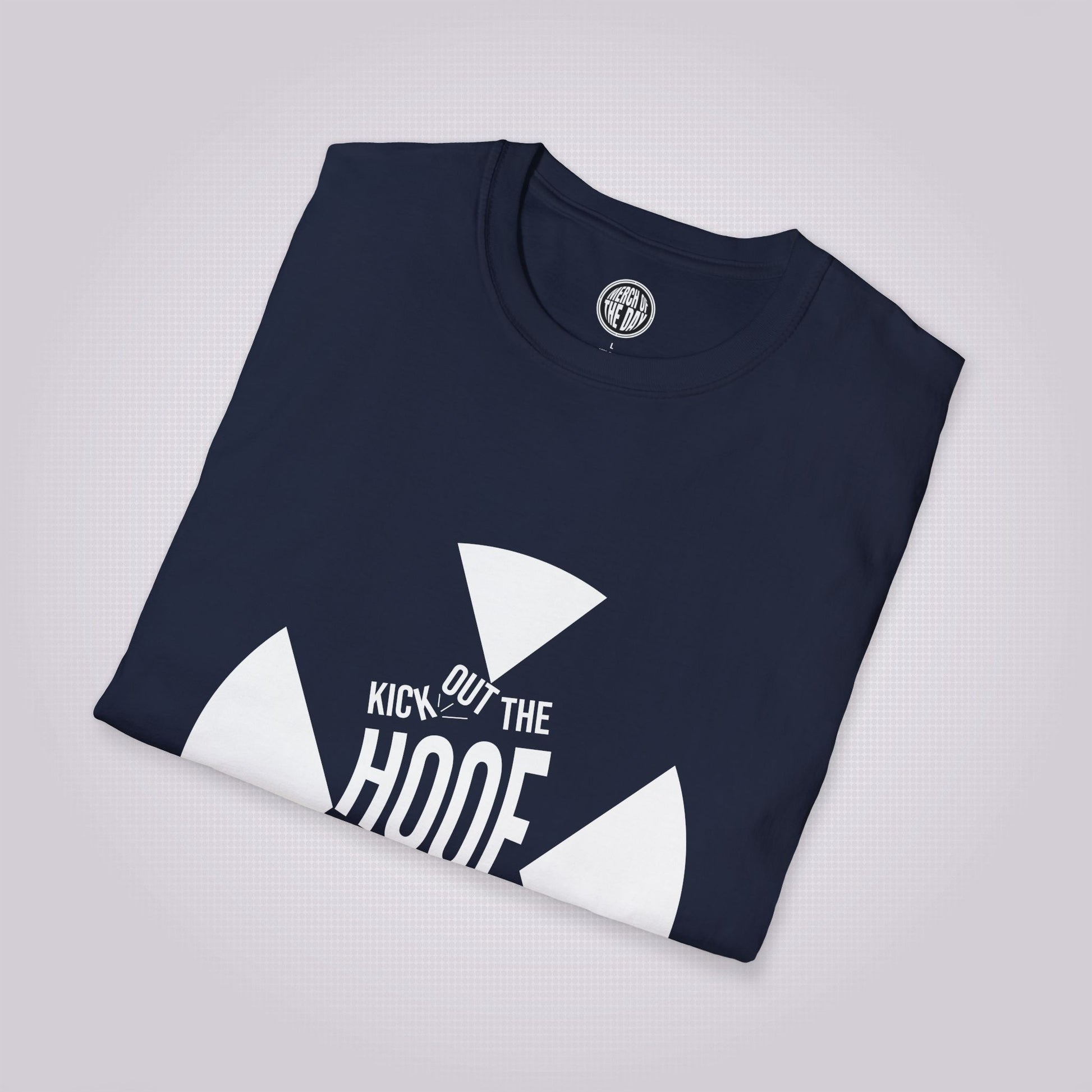 Navy t shirt folded up and placed at a slight right angle on a light grey dotted background