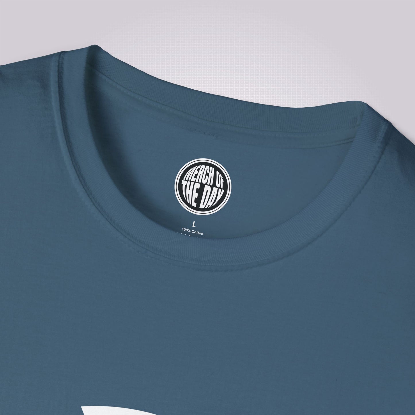 Close up of Indigo blue t shirt showing the crew neckline and clothing brand logo on the inner label