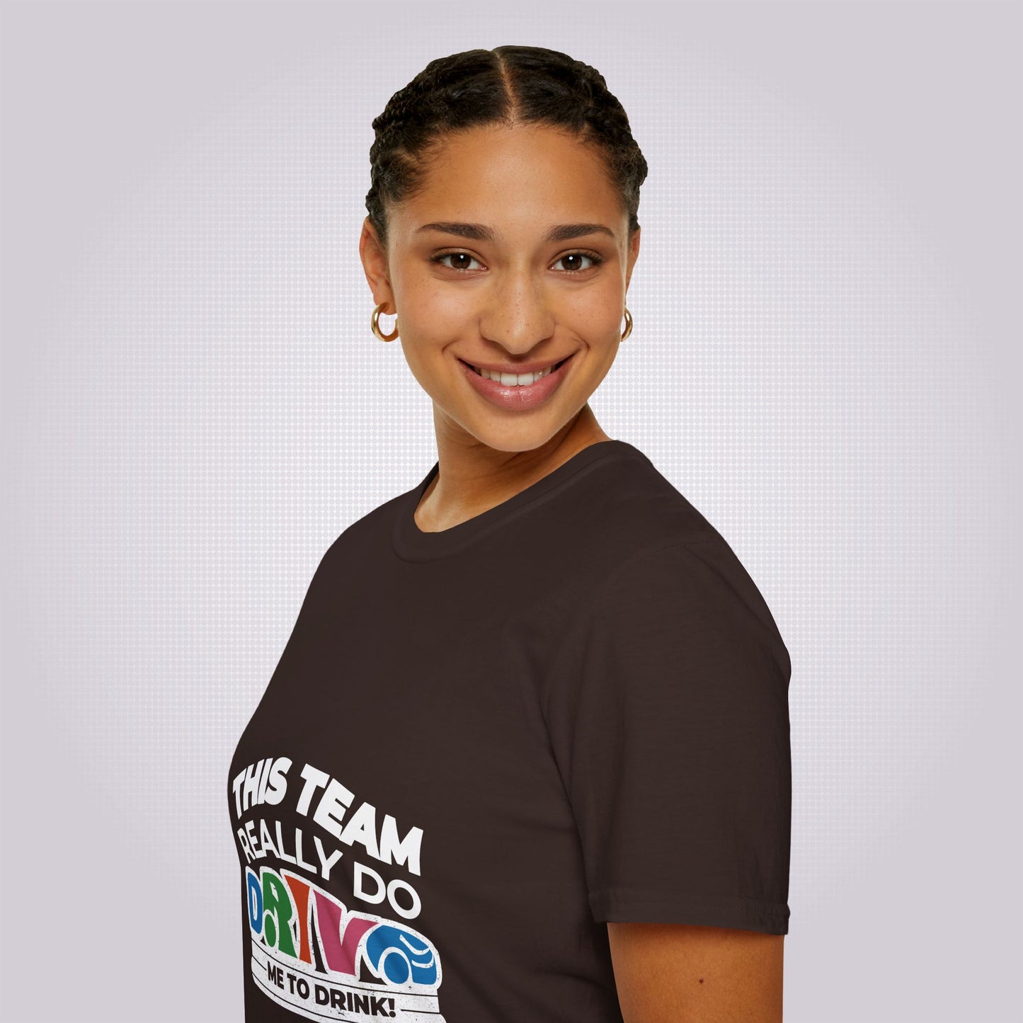 Side profile picture featuring an attractive young mixed race woman in her twenties wearing the brown t shirt her body is facing to the left as you look and her head is turned towards the camera as she smiles