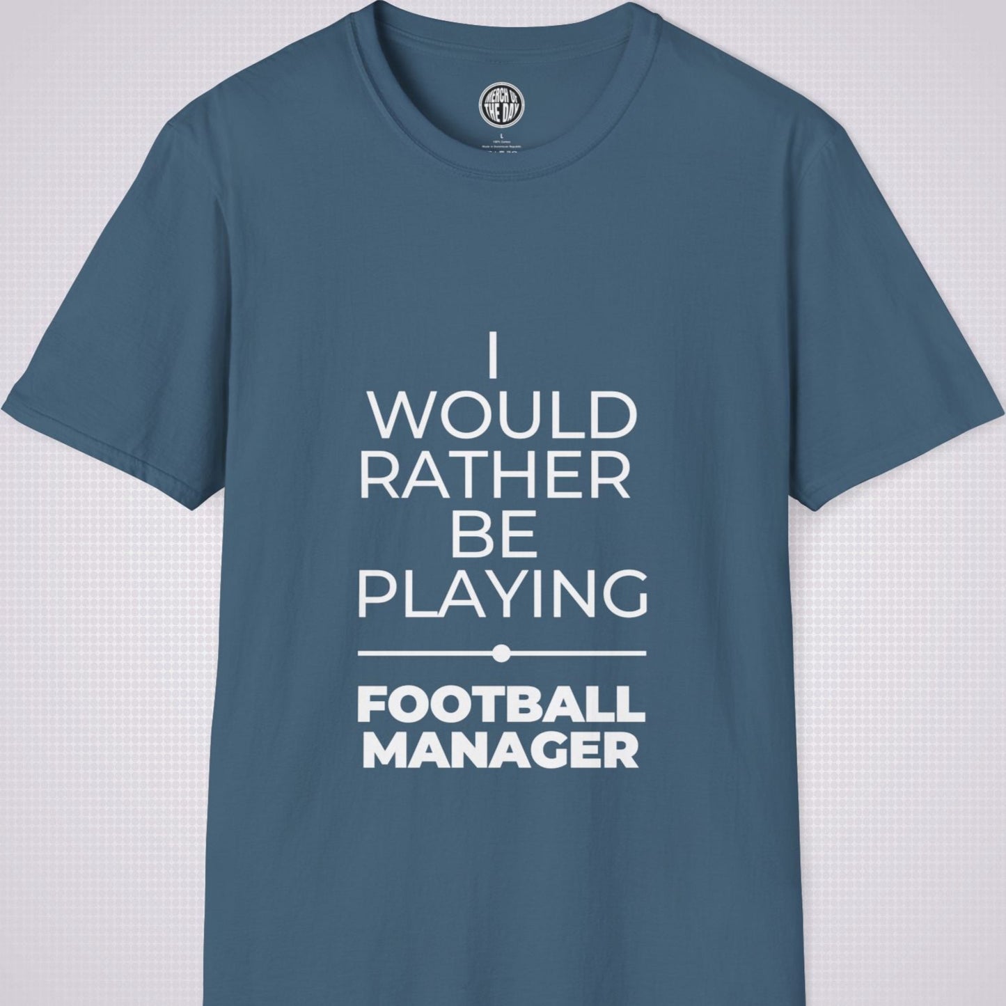 Indigo Blue t shirt on a light grey patterned backdrop with text on the shirt saying I would rather be playing football manager