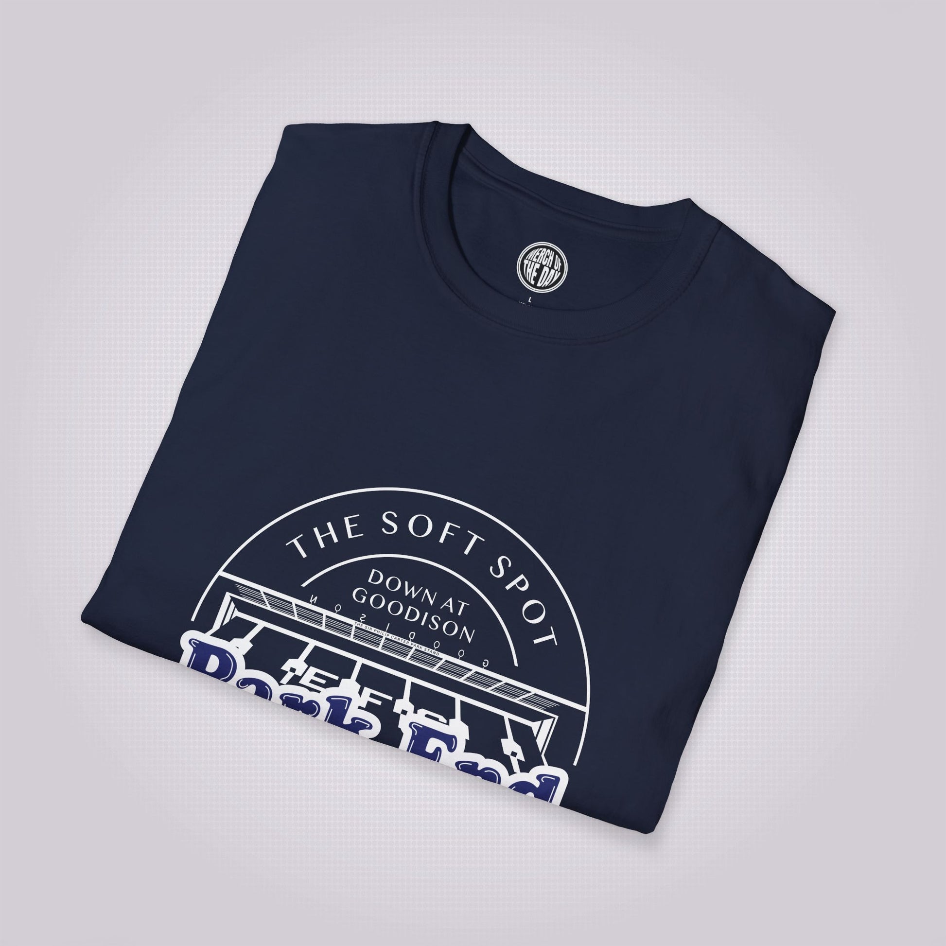 Navy t shirt placed at a slight right angle on a light grey dotted background