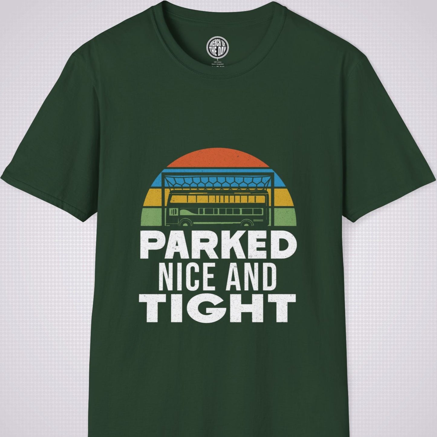 Forest Green T Shirt on a light grey dotted background the graphic shows a distressed sunset with a football goalpost with a bus packed into it and the phrase parked nice and tight