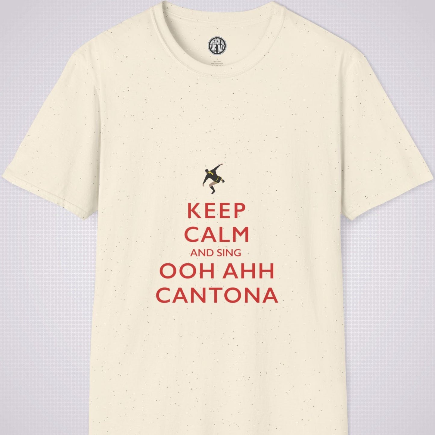 Cream T Shirt on a light grey dotted backdrop. The design on the shirt is done in the keep calm style which reads 'Keep Calm And Sing Ooh Ahh Cantona' in red text, with a cartoon graphic of Eric's famous kung fu kick above it.