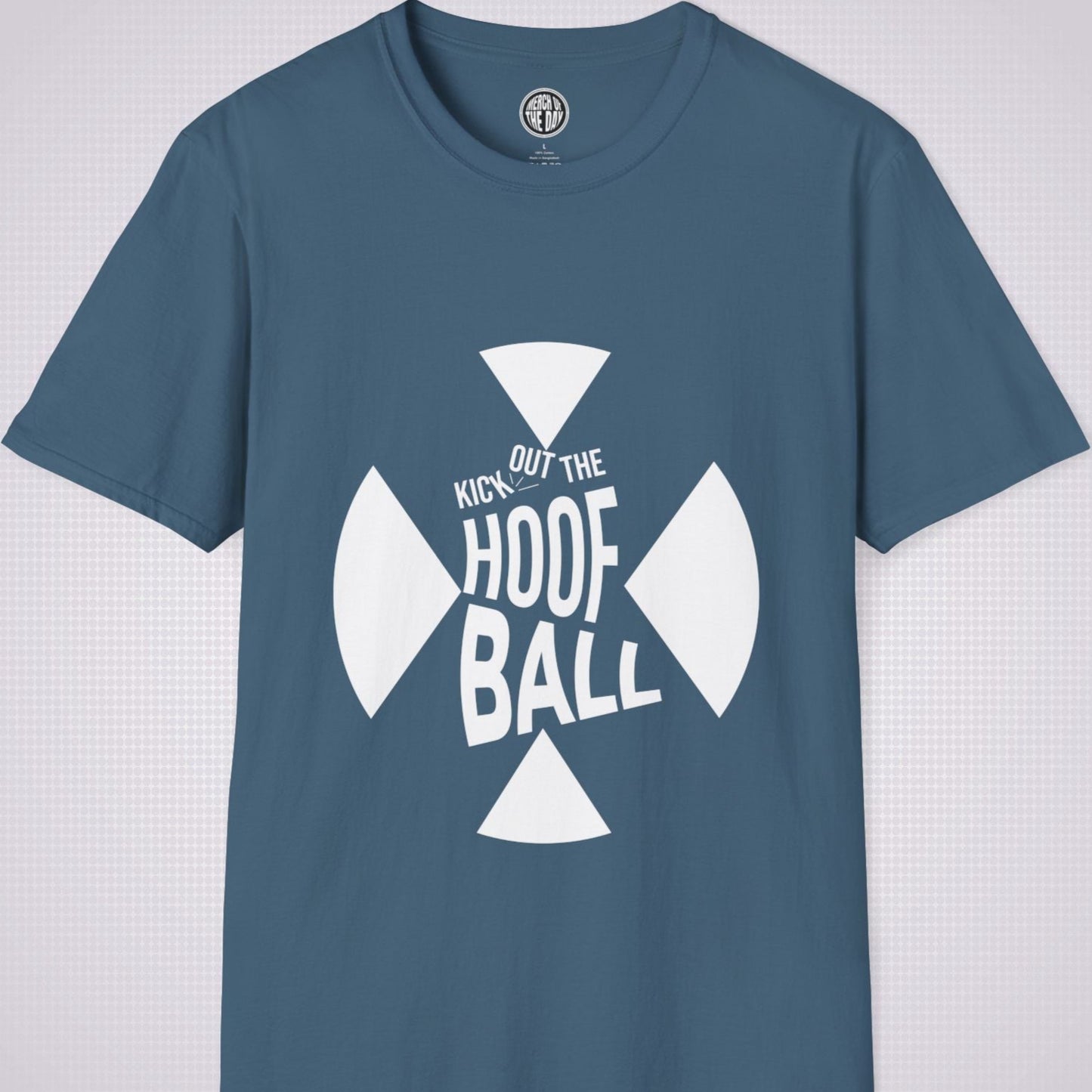 Indigo Blue t shirt on a light grey dotted background. The t shirt has a graphic of a giant X within that are the words 'Kick Out The Hoof Ball' 