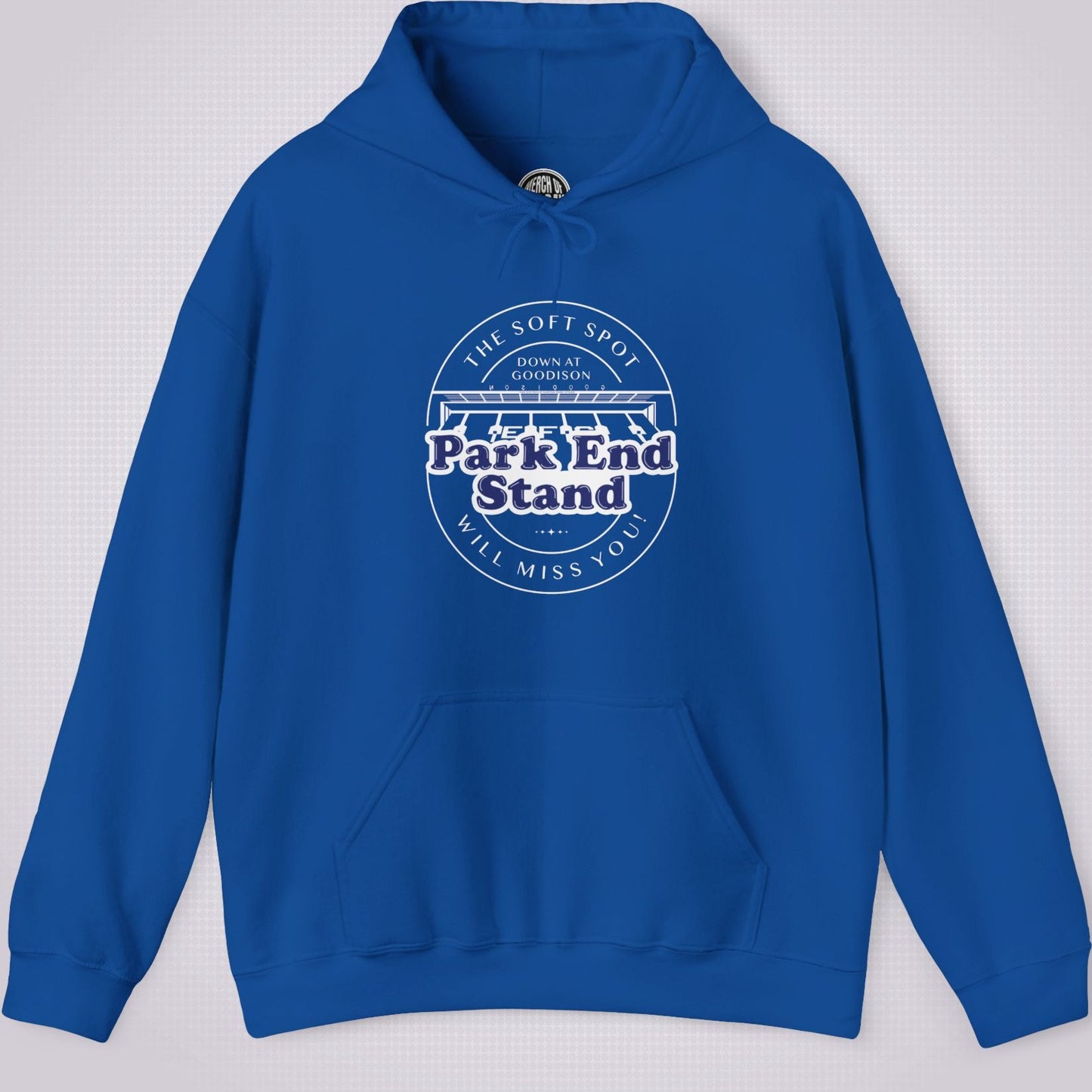 Royal Blue hoodie on a light grey dotted background the artwork on the clothing shows an illustration of the Park End Stand at Goodison Park. Above the illustration are the words 'The Soft Spot' in a downward facing arc, under that it says 'Down at Goodison'. Underneath the illustration it reads "Park End Stand" in bold blue letters with a white fill behind it to make it stand out, then underneath that it reads 'Will Miss You' in a upward facing arc.